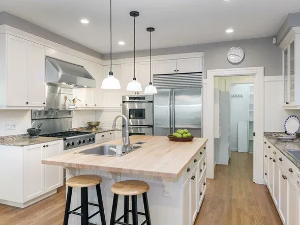 Bright kitchen with white cabinetry Bright kitchen with white cabinetry