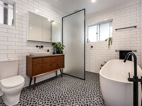 Modern bathroom with bathtub shower and patterned tiles Modern bathroom with bathtub, shower, and patterned tiles