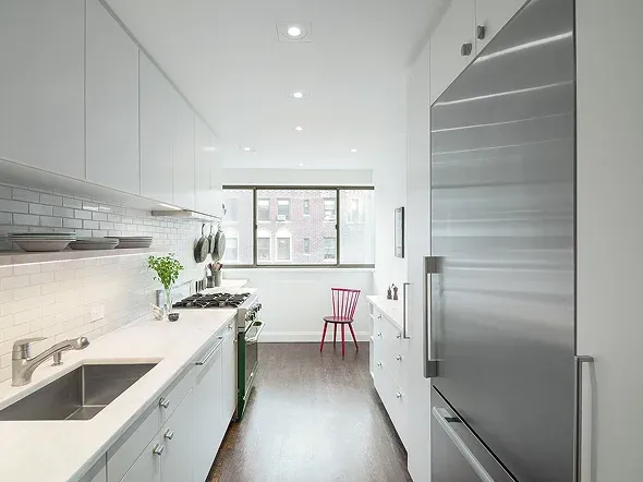 Modern kitchen with stainless steel appliances and window Modern kitchen with stainless steel appliances and window