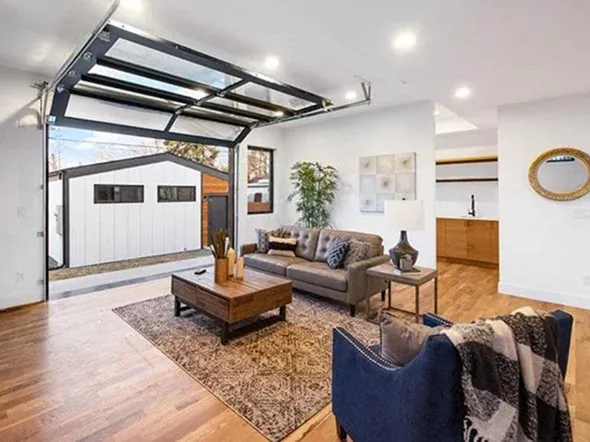 Modern living room with a garage door Modern living room with a garage door