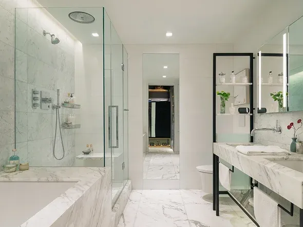 bathroom with marble finishes and glass shower bathroom with marble finishes and glass shower