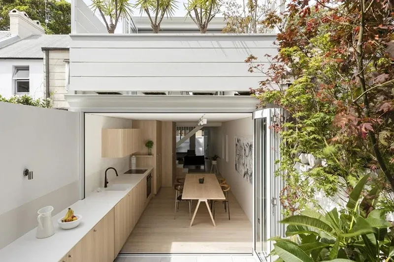 kitchen and dining area with wooden accents