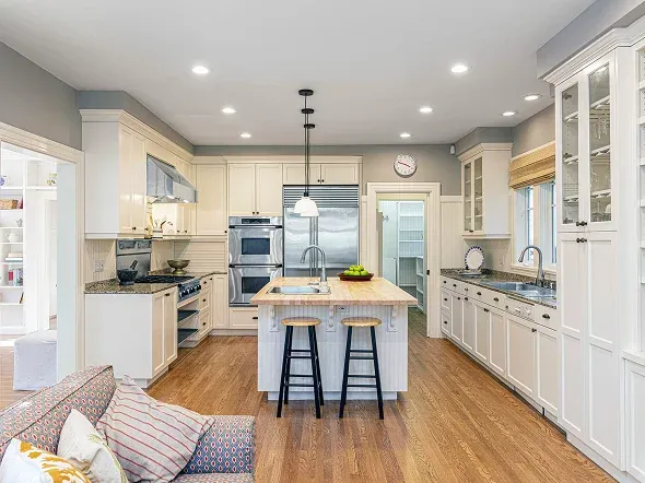 kitchen with white cabinets and wooden flooring kitchen with white cabinets and wooden flooring