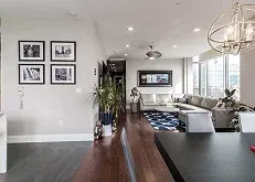 living room with a gray sofa, stylish tables